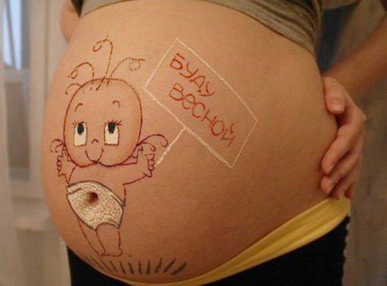 Рисунок на животе беременной
